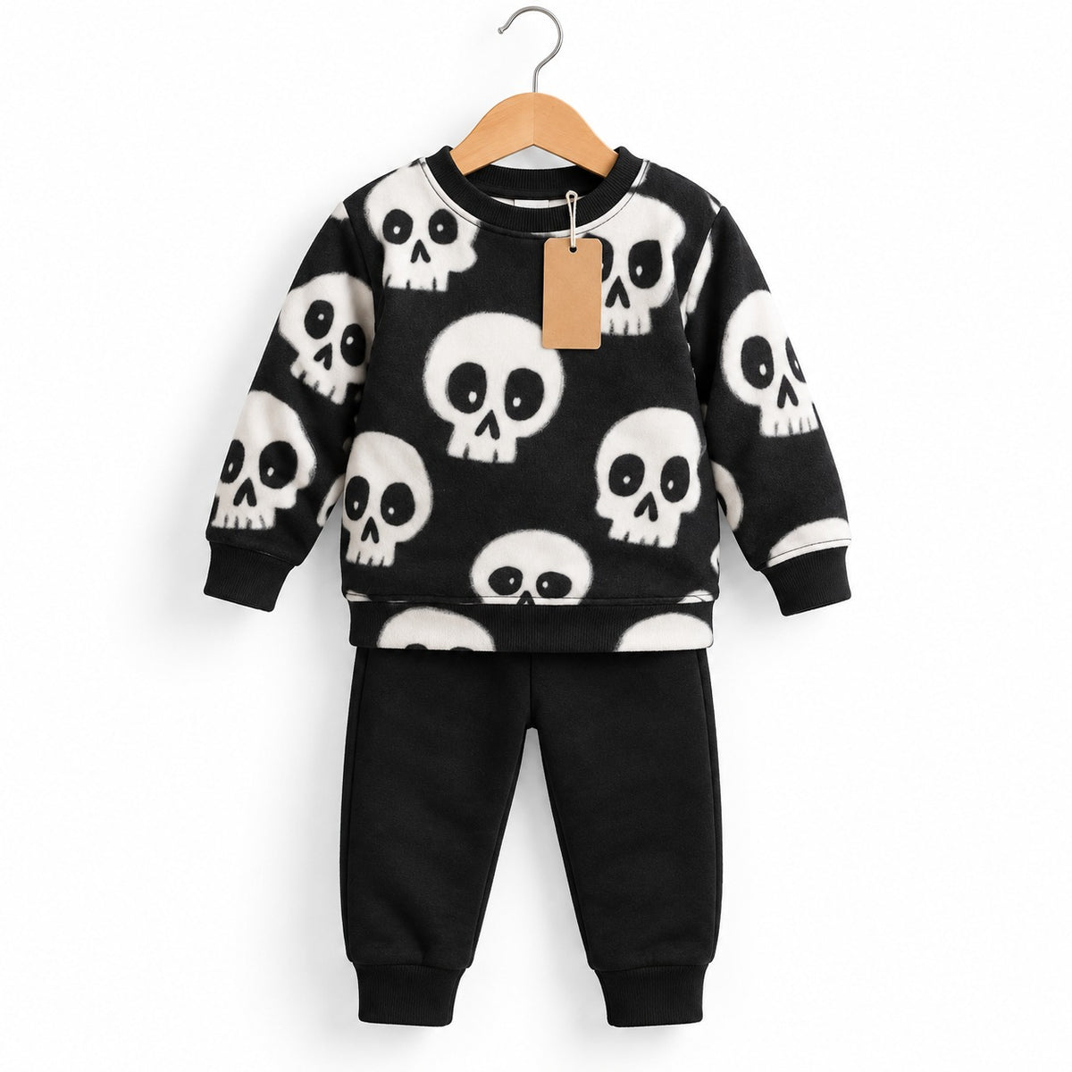Black crewneck sweatshirt with white skull print and matching black cuffed jogger trousers