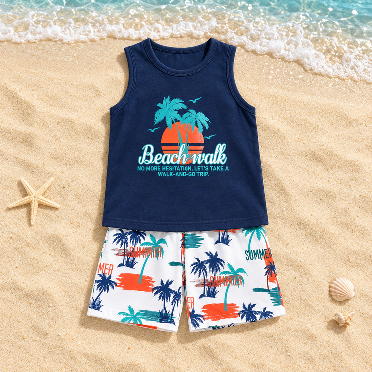 Navy Beach Walk tank top and palm-print shorts set on a realistic sandy beach background