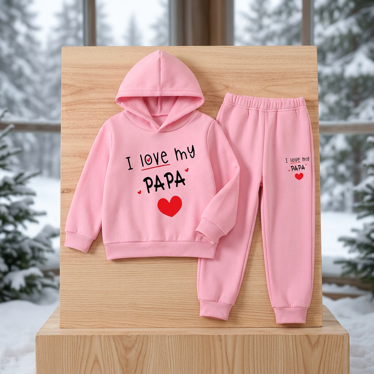 Pink I Love My Papa hoodie and matching trousers without shoes, displayed against a snowy woodland background